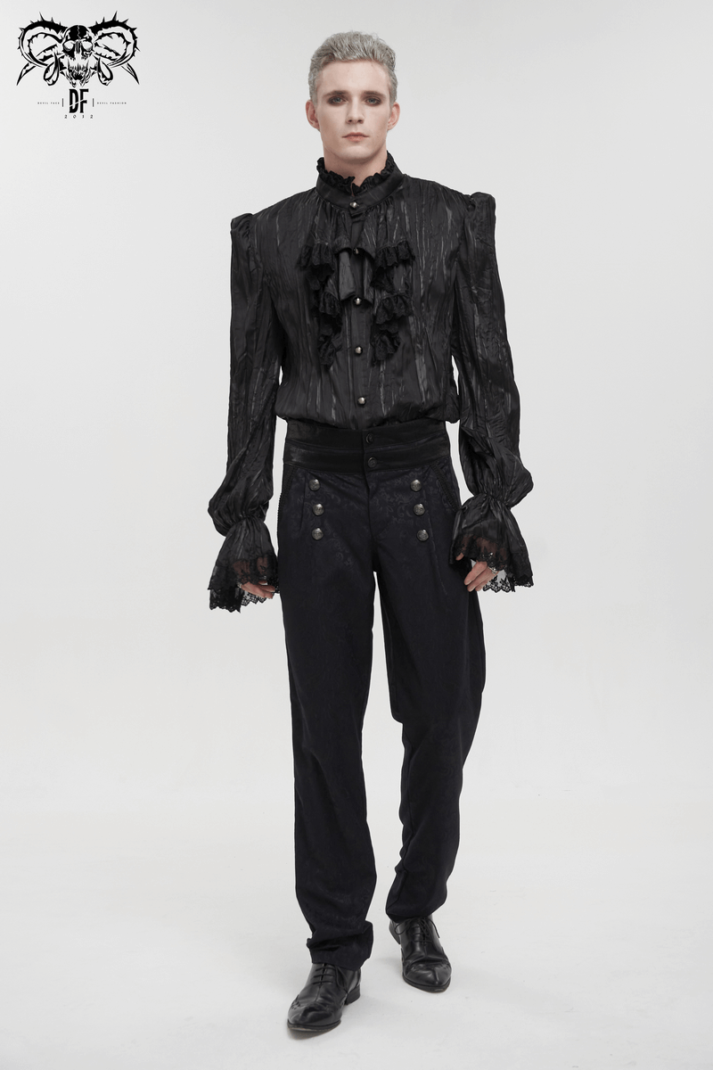 Gothic male model in vintage black high-waisted jacquard pants with buttons and an elegant ruffled shirt.