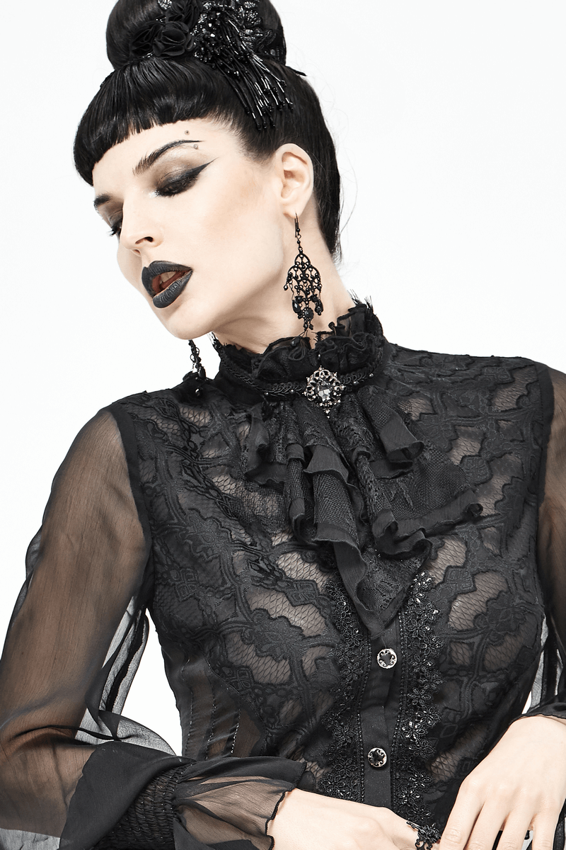 Elegant model in black lace blouse with gothic accessories and dramatic makeup.
