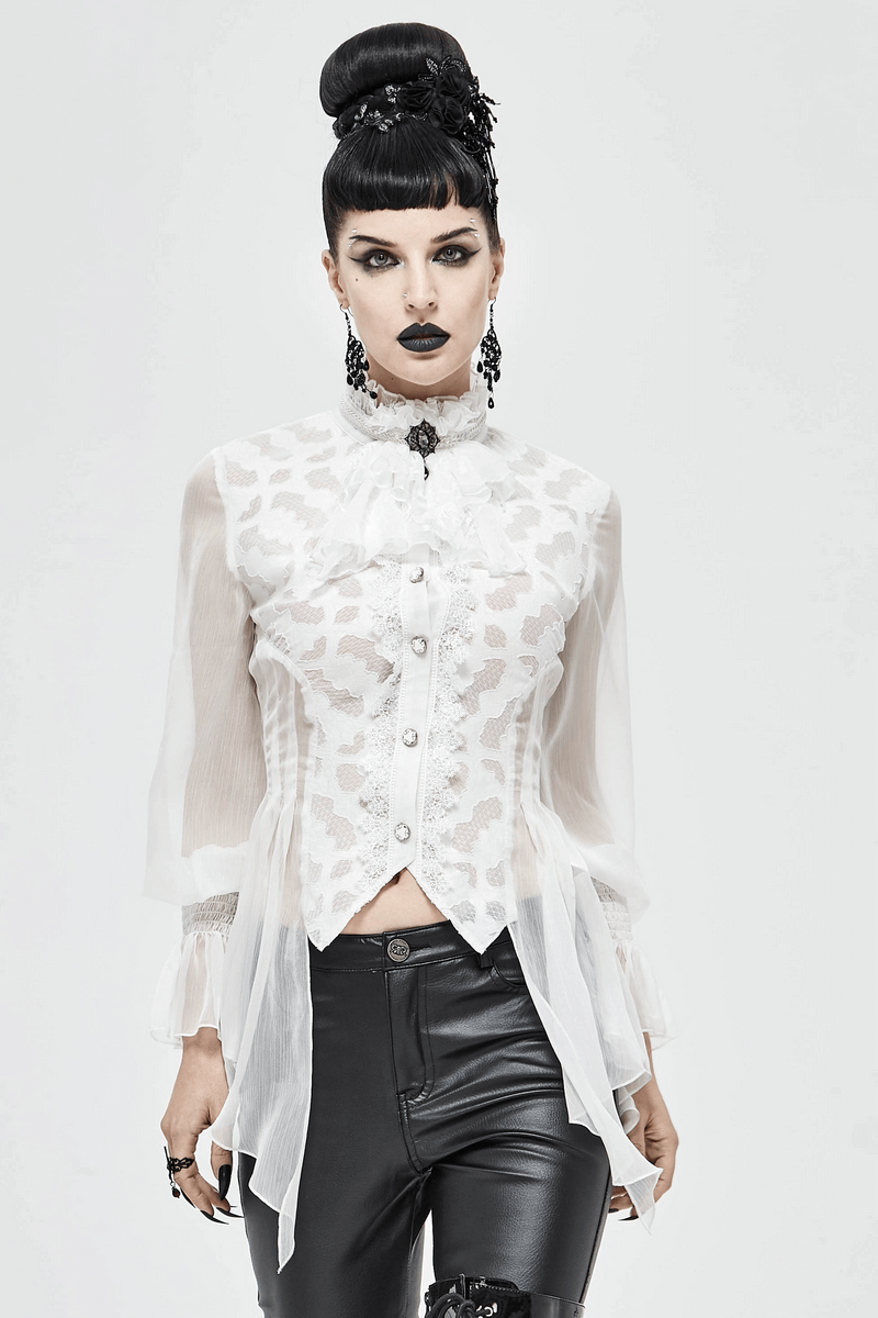 Gothic vintage white blouse with intricate lace details, worn with sleek black pants for a stylish alternative look.