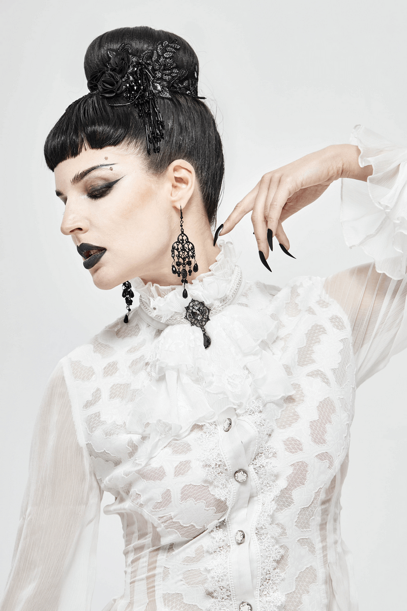 Gothic-inspired model wearing a vintage white lace blouse with dramatic makeup, showcasing alternative style elegance.