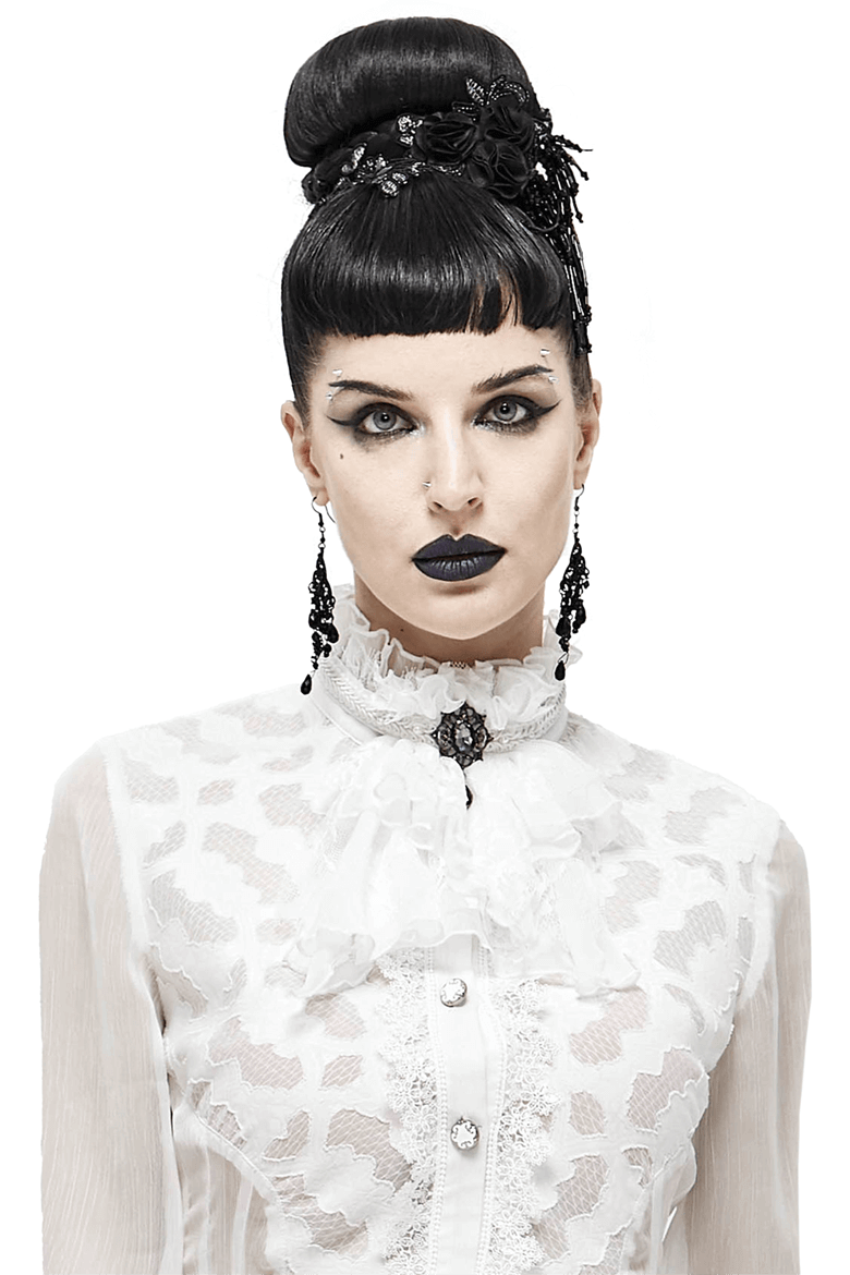 Gothic style model showcasing vintage white lace tie with brooch, exuding elegance and alternative fashion vibes.