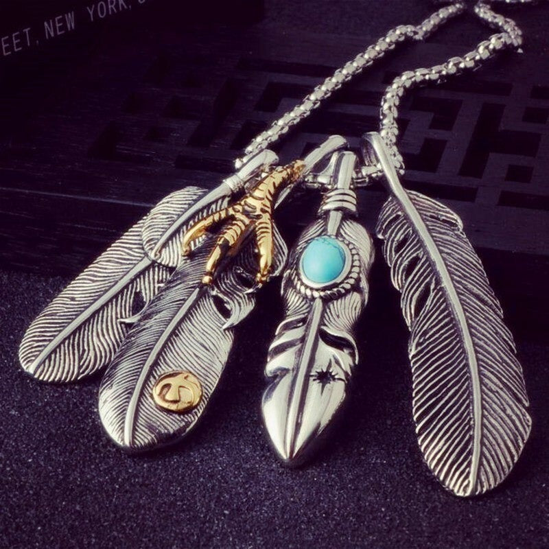 Vintage leaf pendant necklace with feather details in stainless steel, perfect for alt fashion accessories.