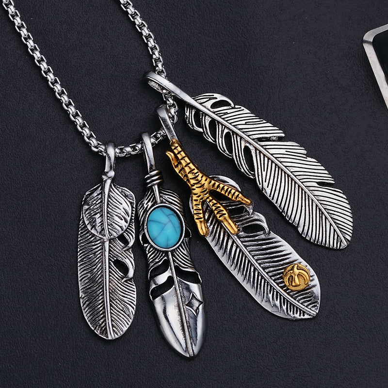 Vintage leaf pendant necklace with feather charms and turquoise, perfect for unique fashion accessories.