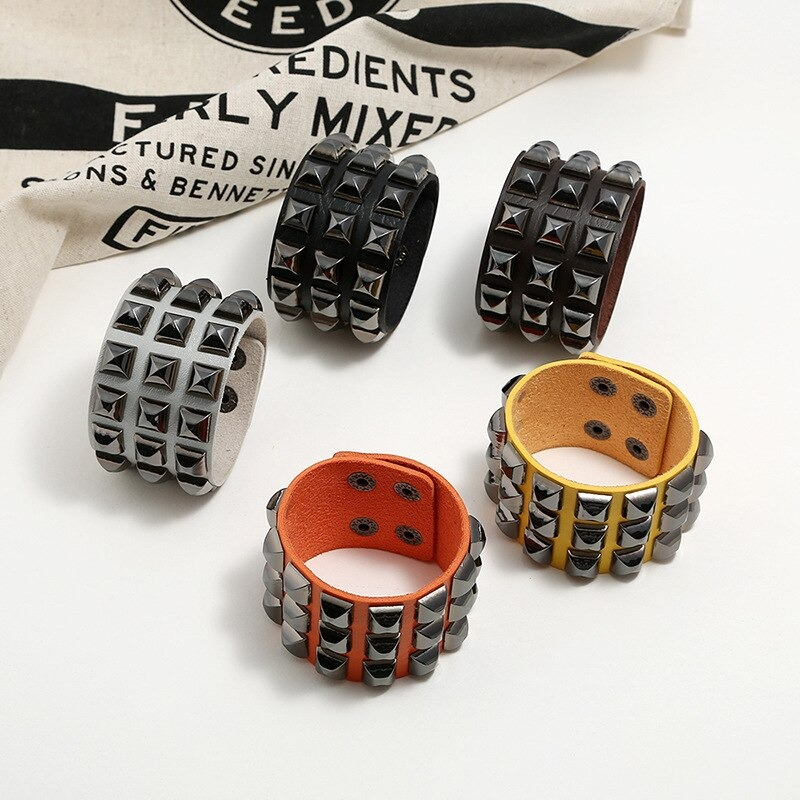 Collection of vintage leather wide cuff bracelets in punk rock style with spikes, suitable for men and women.