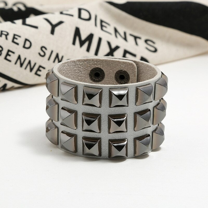 Vintage leather cuff bracelet with spikes in punk rock style for men and women.