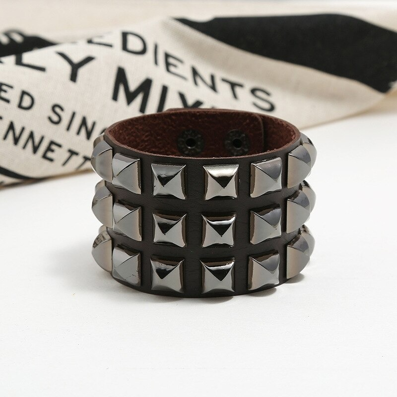Vintage leather cuff bracelet with spikes, perfect punk rock accessory for men and women.