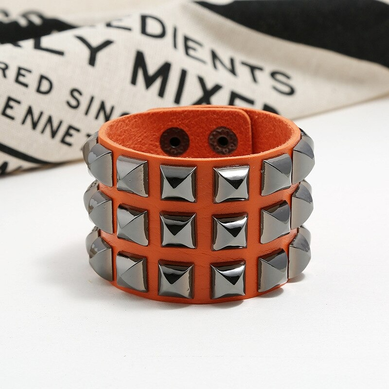 Vintage leather cuff bracelet for men and women with spikes in punk rock style, perfect for edgy fashion.