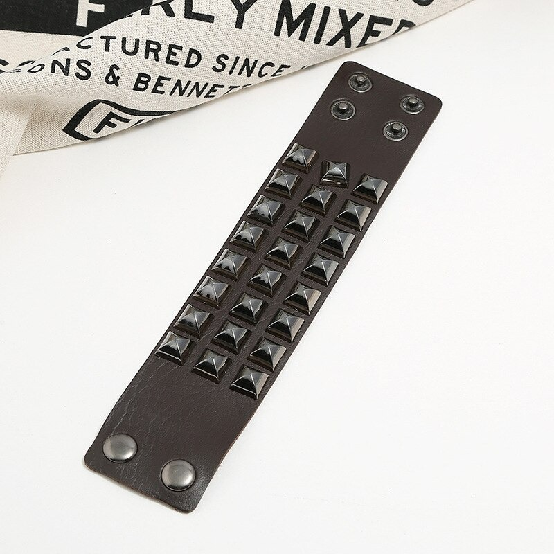 Wide vintage leather bracelet with black spikes, perfect for punk rock style, unisex accessory for men and women.