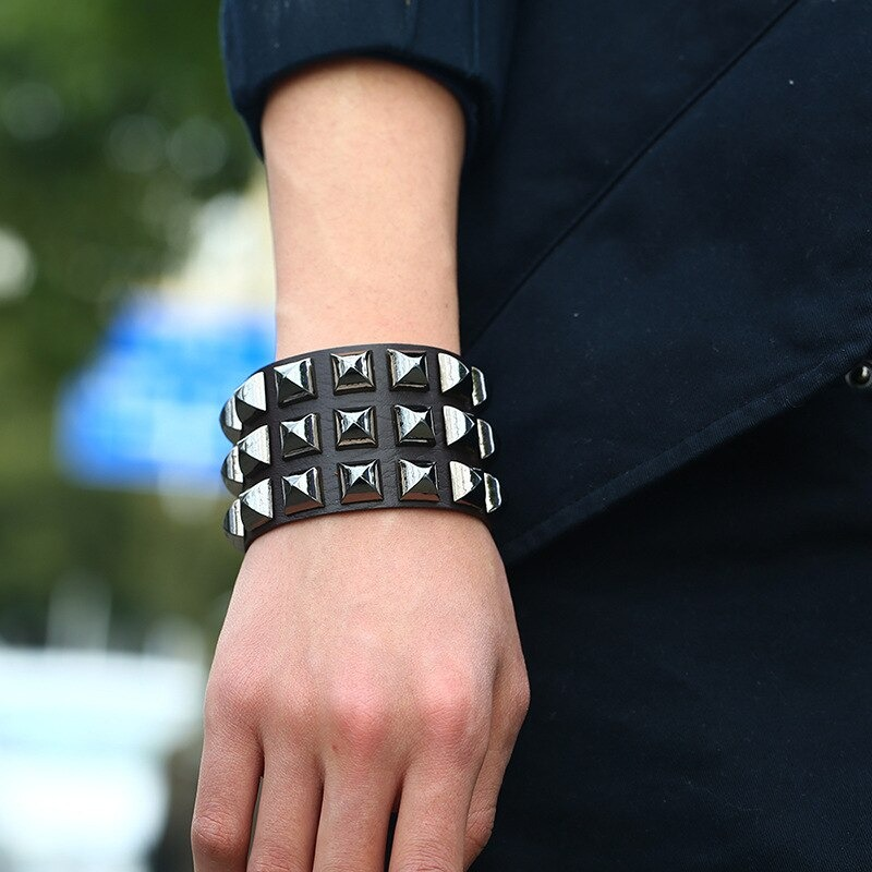 Vintage leather cuff bracelet with spikes, styled for punk rock fashion, unisex accessory for men and women.