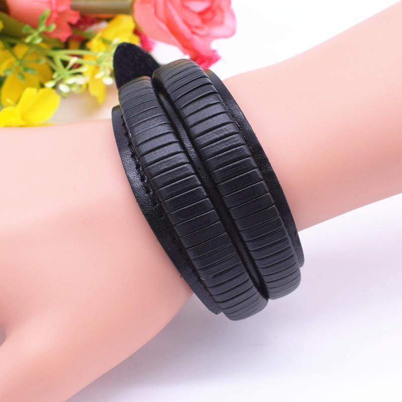 Vintage black leather bracelet on hand showcasing double wide design and zinc alloy detail, ideal for any occasion.