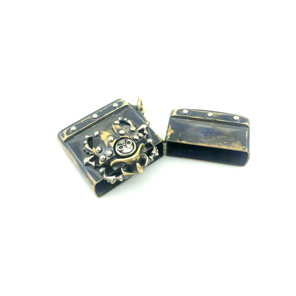 Vintage lighter case with rivets featuring a unique beetle design, stylish metal accessory for unisex use.