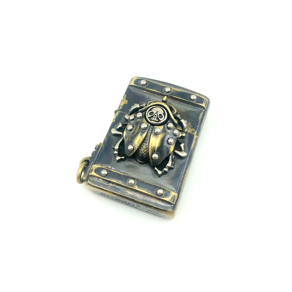 Vintage unisex lighter case with rivets and beetle design, stylish metal accessory for alternative fashion lovers.