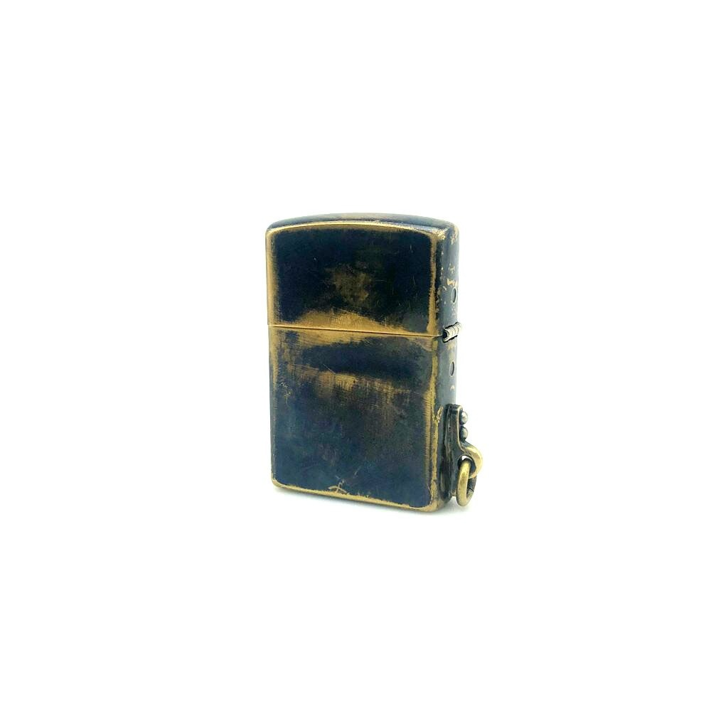 Vintage metal lighter case with rivets, stylish accessory for unisex use, alternative design, perfect gift idea.
