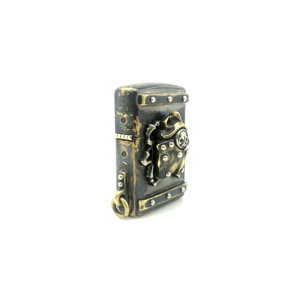 Vintage unisex lighter case with rivets, stylish metal accessory showing a unique design.