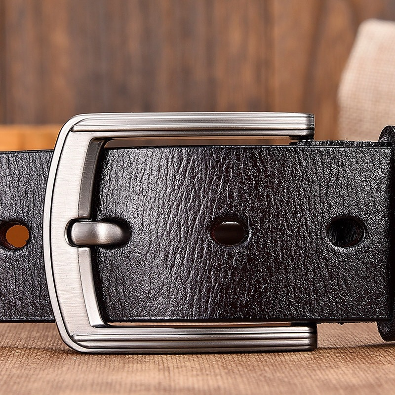 Close-up of a stylish vintage PU leather belt with a metal buckle, perfect for unisex casual outfits.