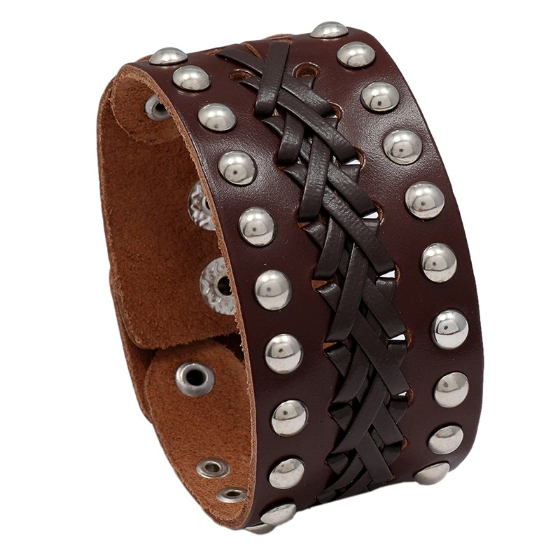 Wide vintage male leather bracelet with silver rivets and manual weave in punk rock style.