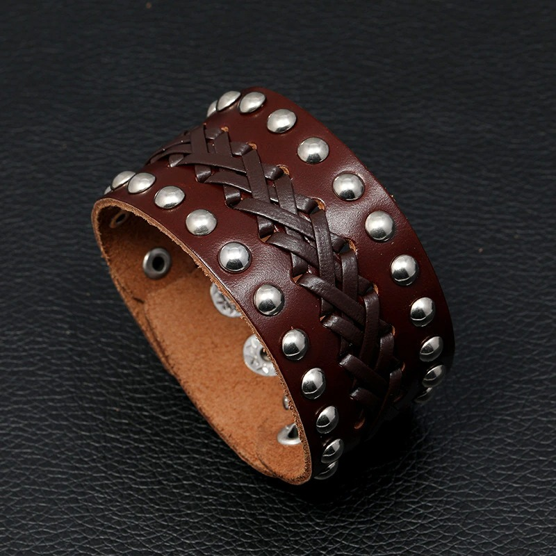 Wide vintage male leather bracelet with manual weave and silver rivets, perfect for punk rock style.