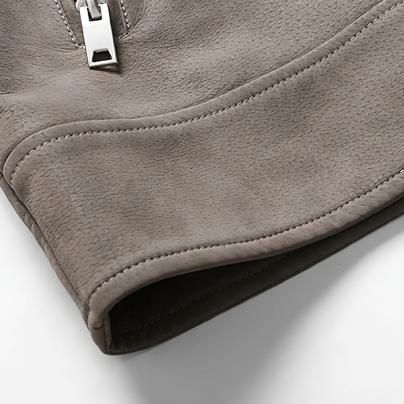 Close-up of vintage men's PU leather jacket sleeve with zipper detail, showcasing premium craftsmanship.