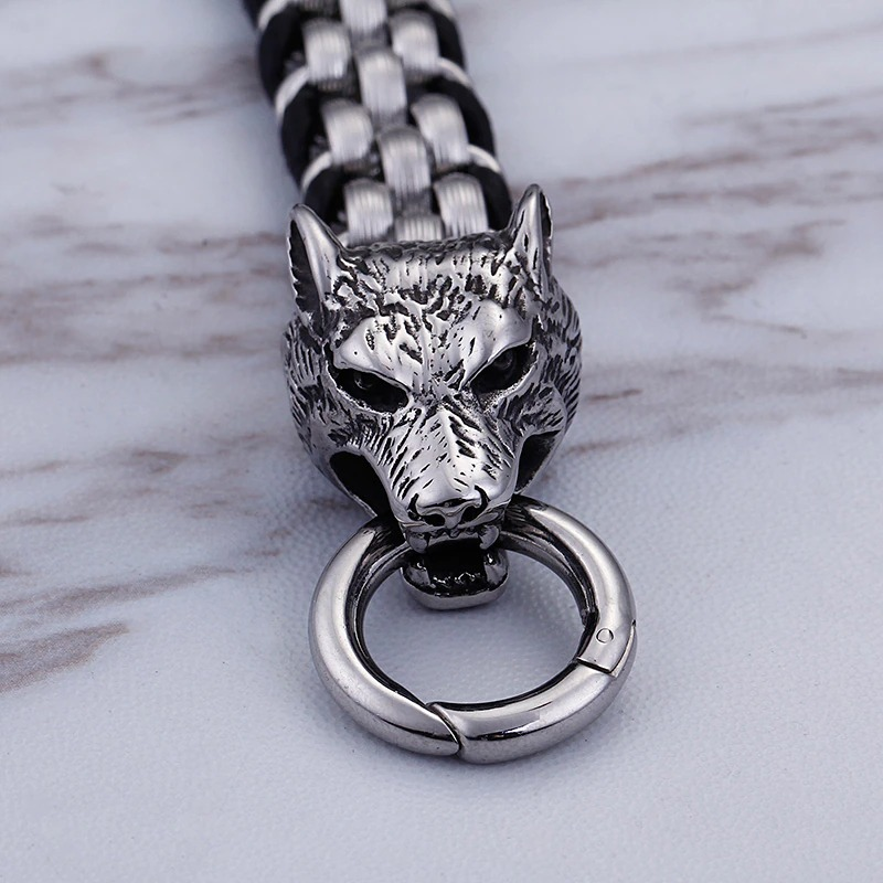 Close-up of a vintage men's stainless steel bracelet featuring a detailed wolf head clasp.