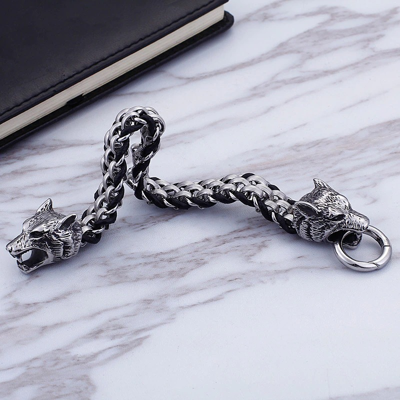 Vintage men's stainless steel bracelet featuring wolf heads, perfect for a stylish casual look.