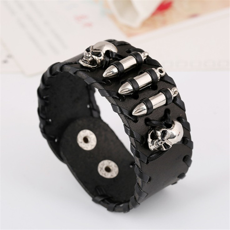 Vintage metal skull leather bracelet with bullet accents for men and women, perfect for rock-style fashion.