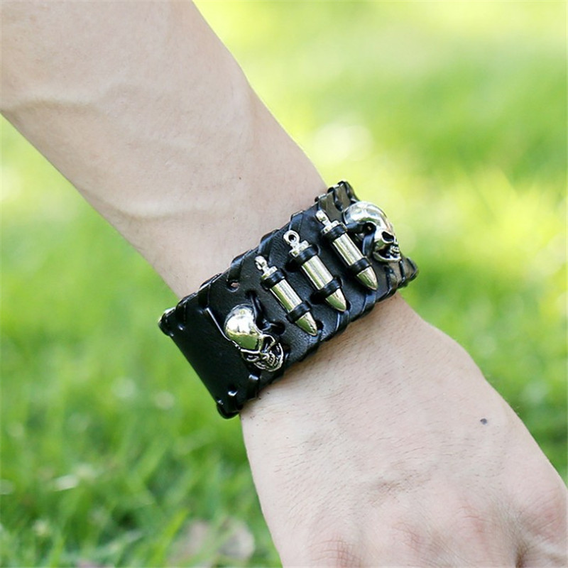 Vintage metal skull leather bracelet wrapped around a wrist, perfect for rock fashion and alternative styles.