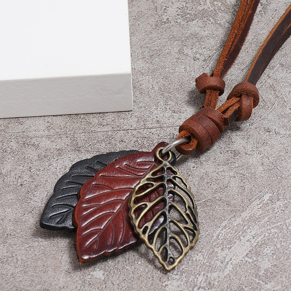Vintage leather necklace pendant with tree leaves in brown and black, perfect for punk style jewelry.