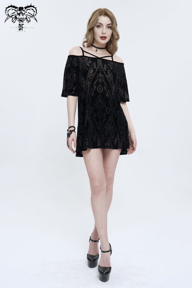 Stylish model showcasing a vintage punk off-shoulder loose dress with cross straps in black.