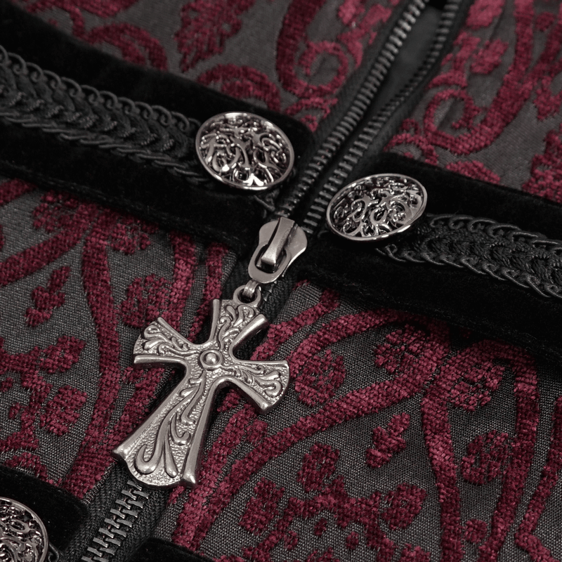 Close-up of a vintage patterned tailcoat zipper featuring a gothic cross pendant and ornate buttons.