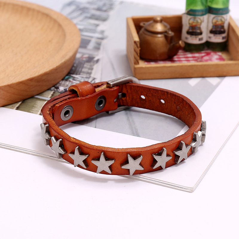 Vintage brown PU leather bracelet with silver stars, a trendy punk-rock accessory for men and women.