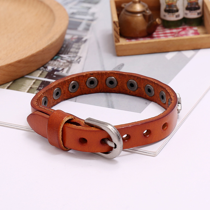 Vintage PU leather bracelet for men and women with silver studs, perfect for punk-rock style and unisex fashion.