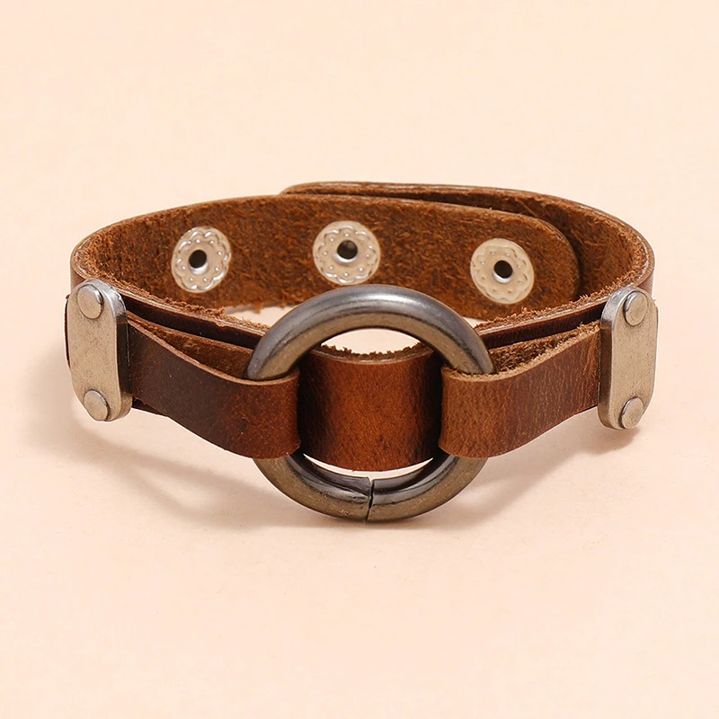 Vintage PU leather bracelet with rivets and alloy circle, perfect for stylish punk and biker outfits.