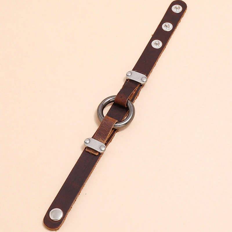 Vintage brown PU leather bracelet with rivets and alloy circle, perfect for punk and biker styles.