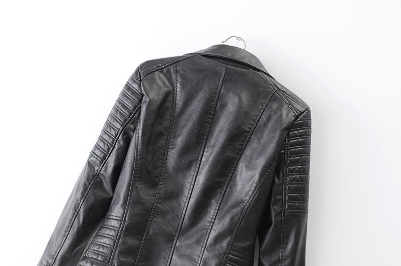 Back view of a vintage black faux leather motorcycle jacket for women with stylish detailing and a rock vibe.