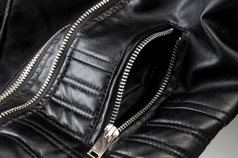 Close-up of zipper detail on a vintage PU leather motorcycle jacket for women, showcasing rock style fashion.