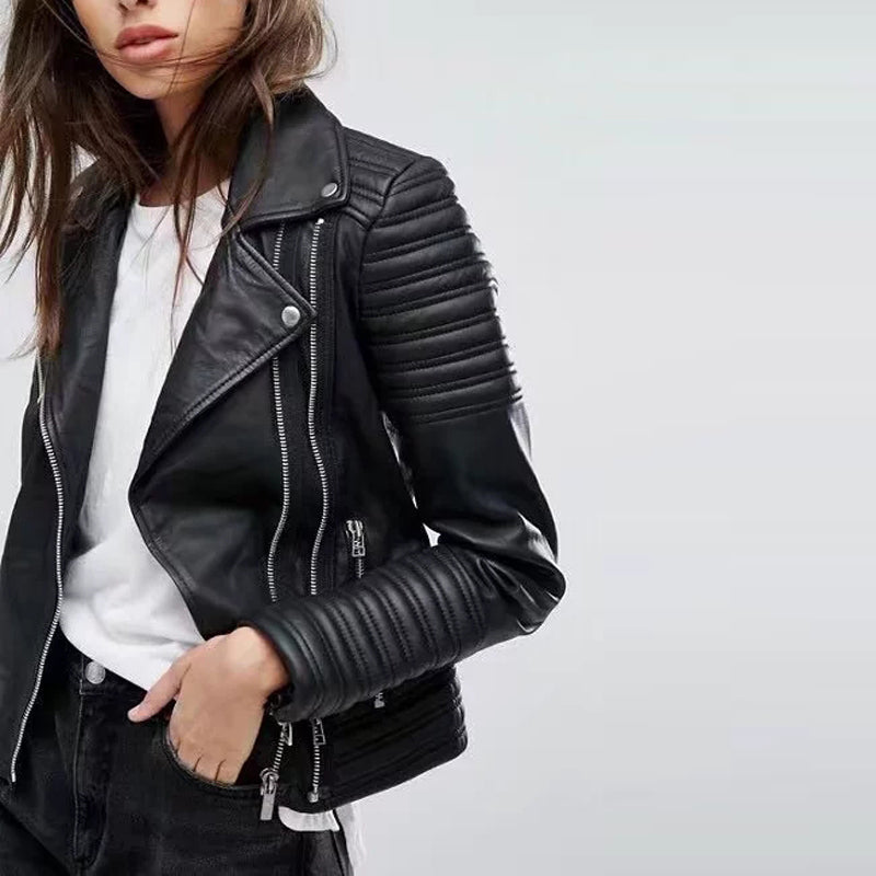 Stylish woman in a black vintage PU leather motorcycle jacket with zippers and ribbed sleeves, perfect for a rock look.