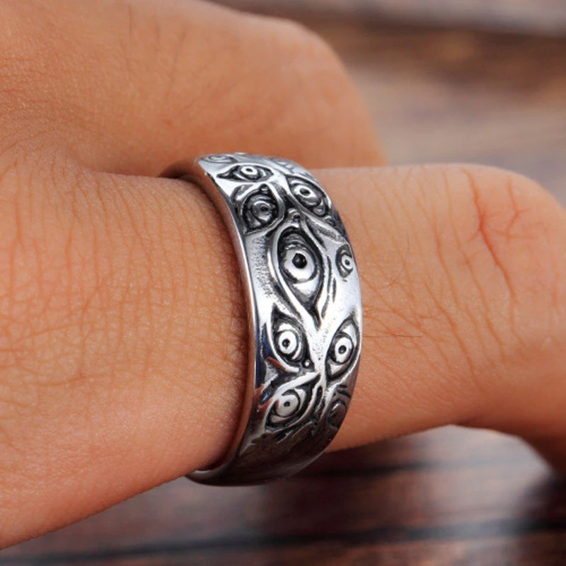 Vintage punk ring with carved eye design, unisex zinc alloy ring on hand, ideal for alternative style outfits.