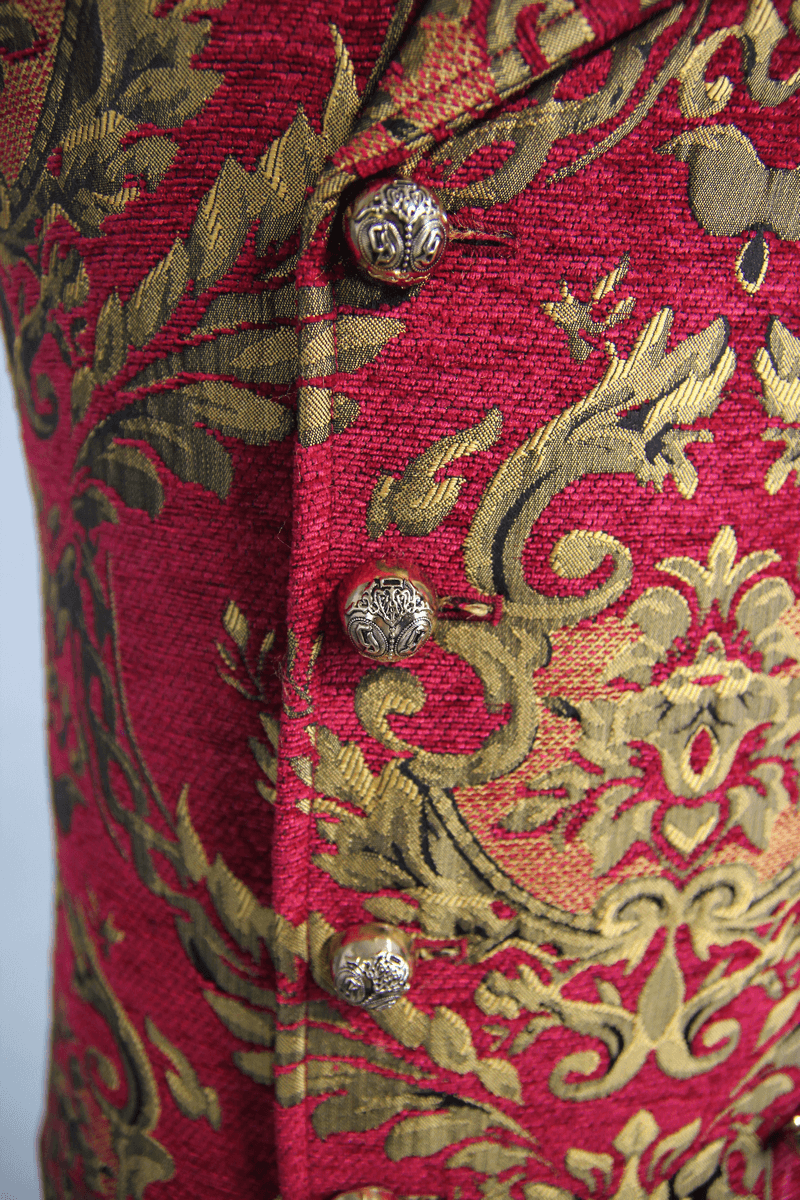 Close-up of vintage red waistcoat with golden filigree pattern and decorative buttons, showcasing gothic style for men.