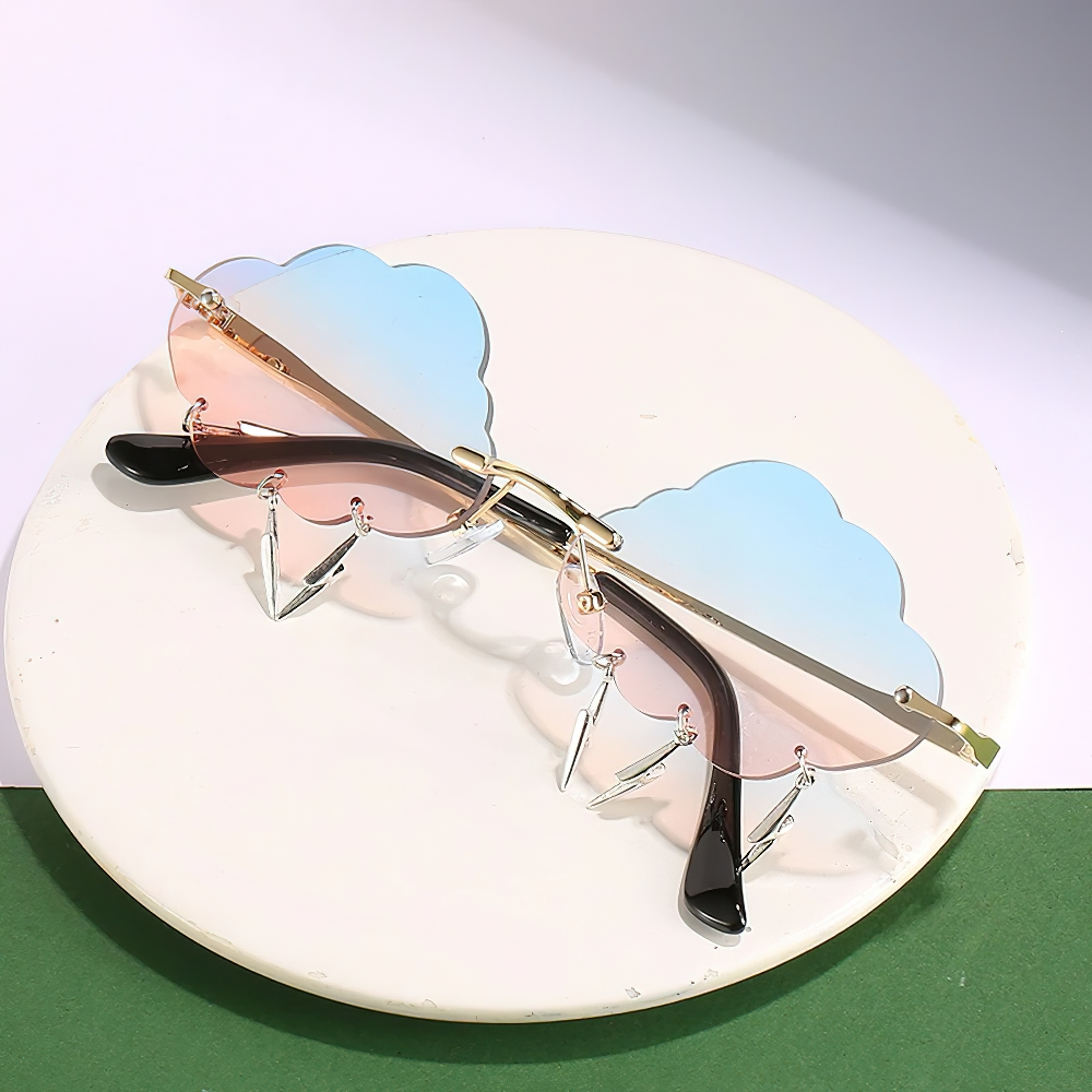 Vintage rimless cloud sunglasses with lightning details, perfect alternative style accessory for unisex fashion lovers.