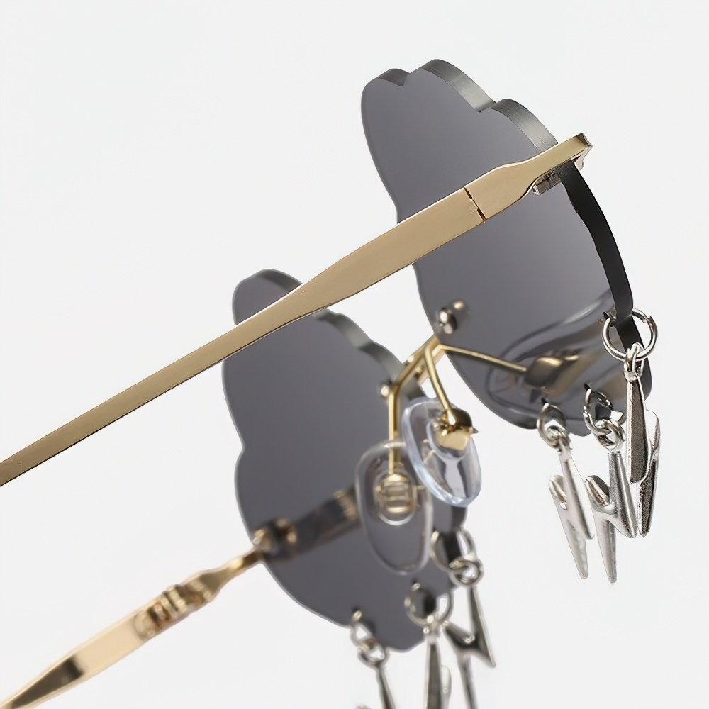 Vintage rimless cloud sunglasses with gold accents and lightning decorations, perfect for a trendy unisex look.