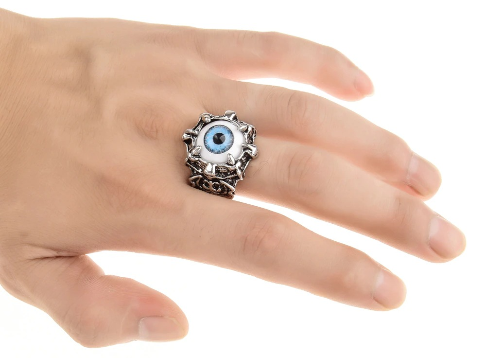 Vintage dragon claw ring with evil eye design on a hand, perfect punk jewelry accessory for bold outfits.
