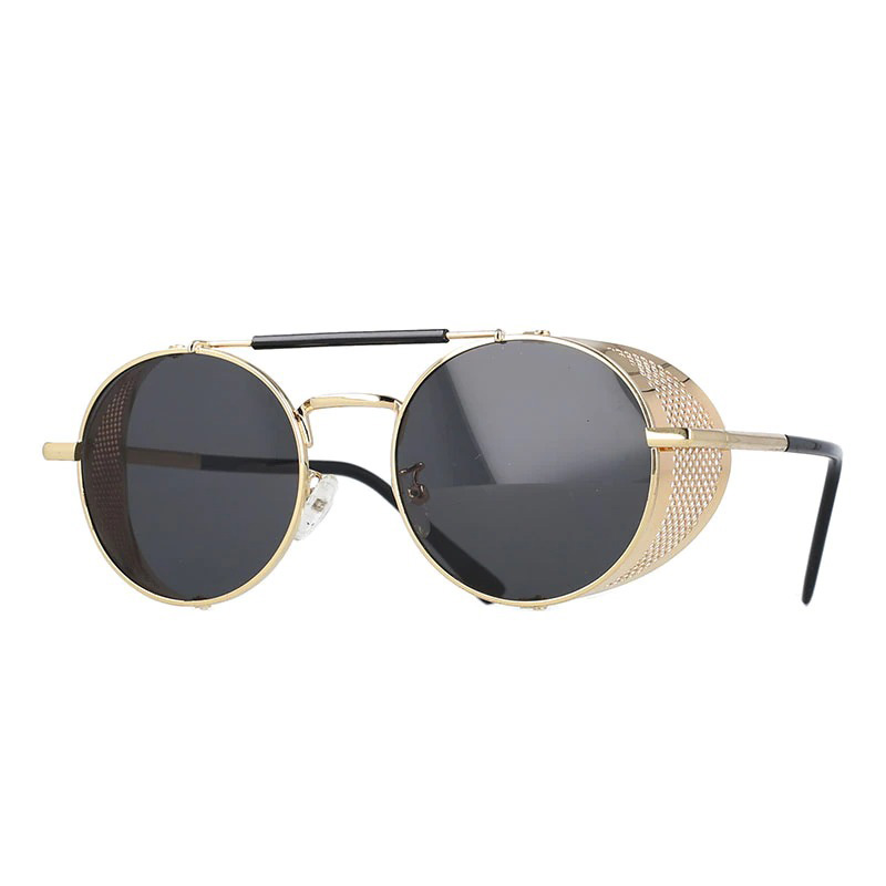 Vintage round metal sunglasses with unique side detail and polycarbonate lenses, perfect for retro outfits.