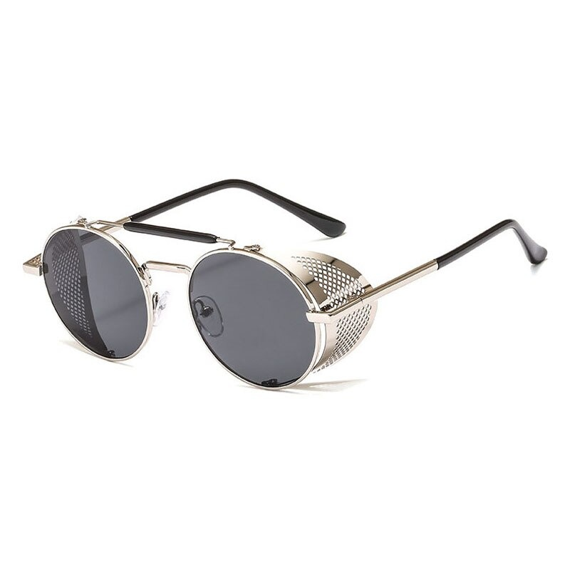 Vintage round metal sunglasses in silver with polycarbonate lenses, perfect for retro outfits and edgy styles.