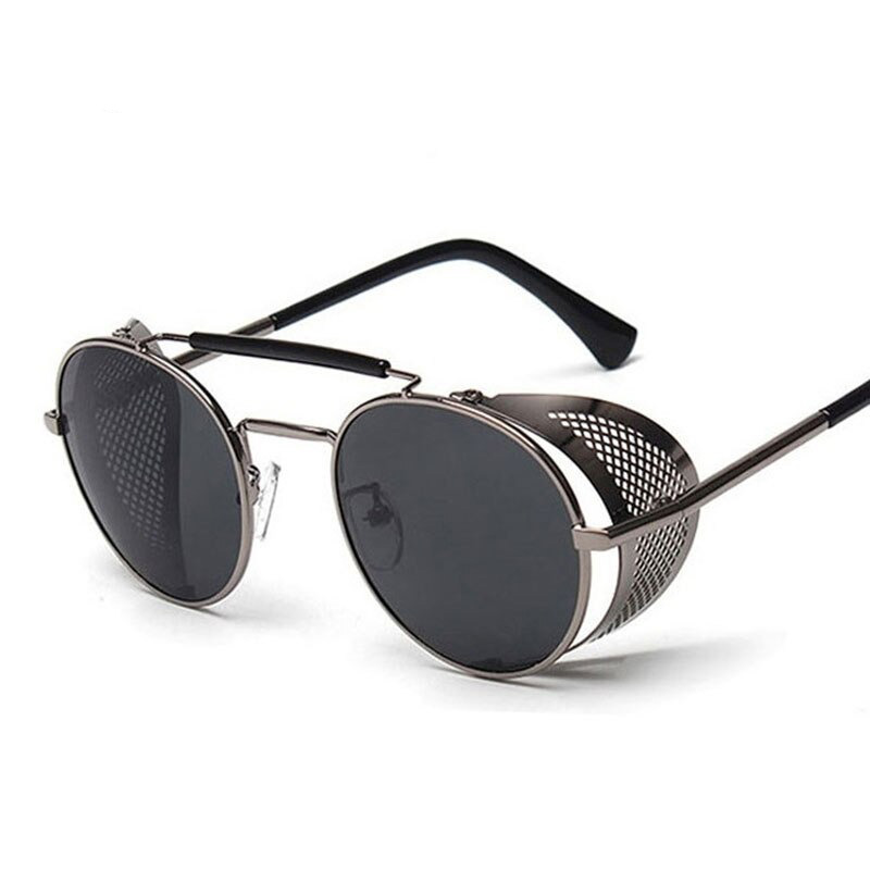 Vintage round metal sunglasses with polycarbonate lenses for a stylish retro look.