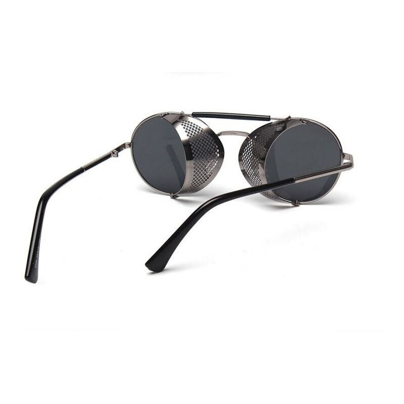 Vintage round metal sunglasses with polycarbonate lenses, perfect for retro and edgy outfits.