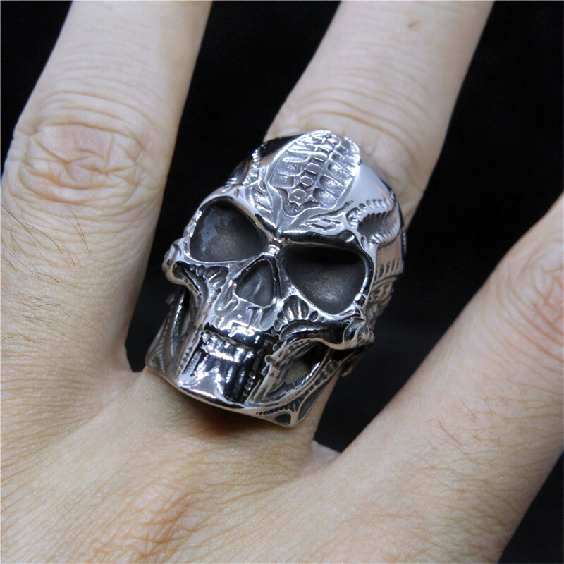 Vintage skull ring on a hand, showcasing gothic stainless steel design perfect for biker, punk, and goth fashion.