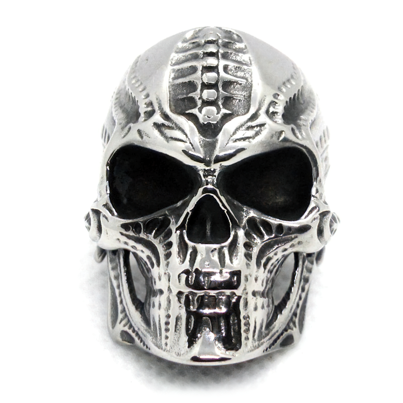 Vintage stainless steel skull ring featuring intricate gothic detailing, perfect for biker and punk styles.