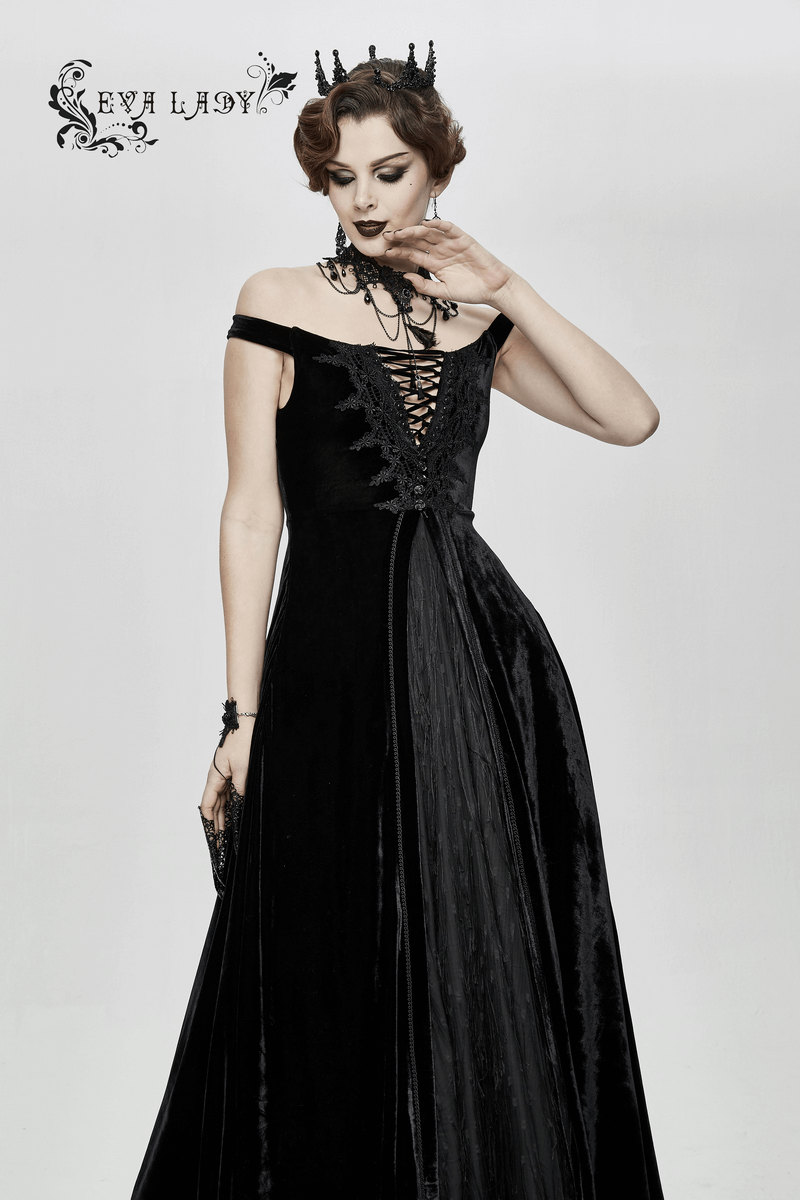 Elegant woman in a vintage off-shoulder black velvet long dress with lace details, showcasing gothic style and grace.