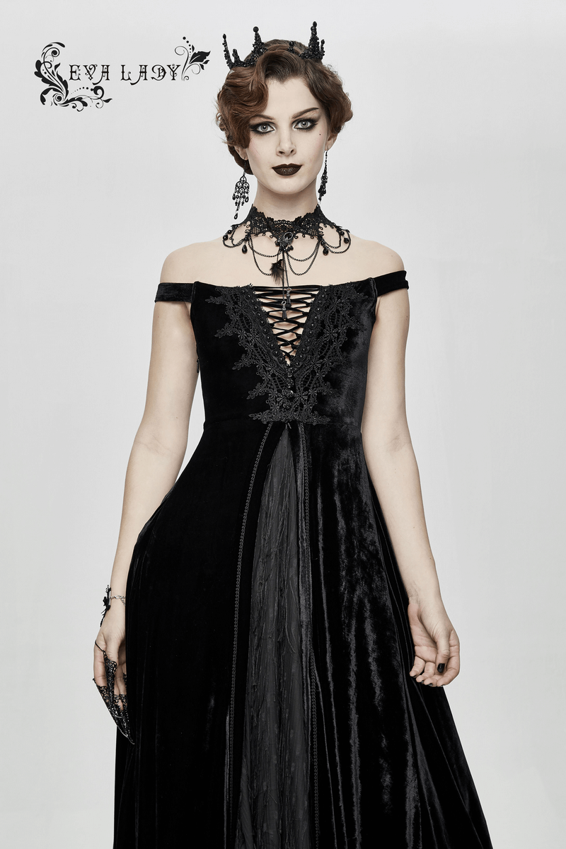Elegant woman in a vintage off-shoulder black velvet dress with lace, showcasing gothic style and grace.