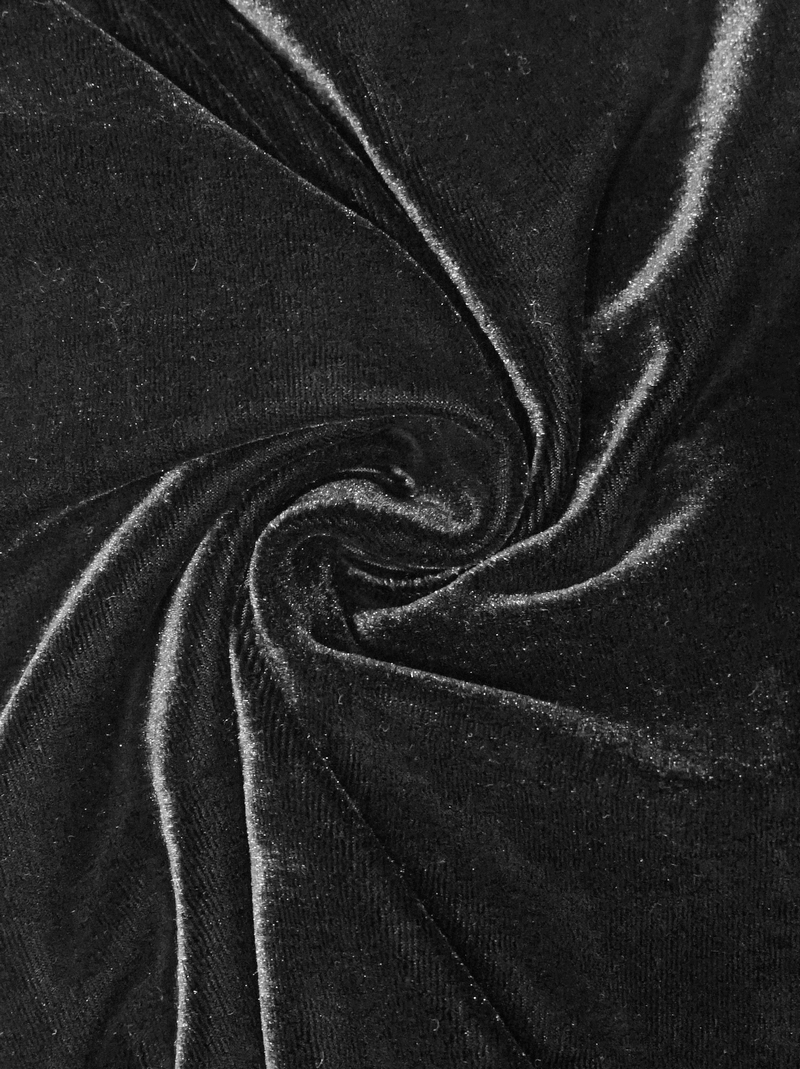 Close-up of luxurious black velvet fabric, showcasing its soft texture and sheen, perfect for a gothic style dress.